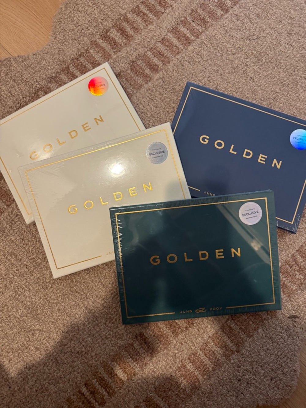 Four unopened Jungkook albums with PC